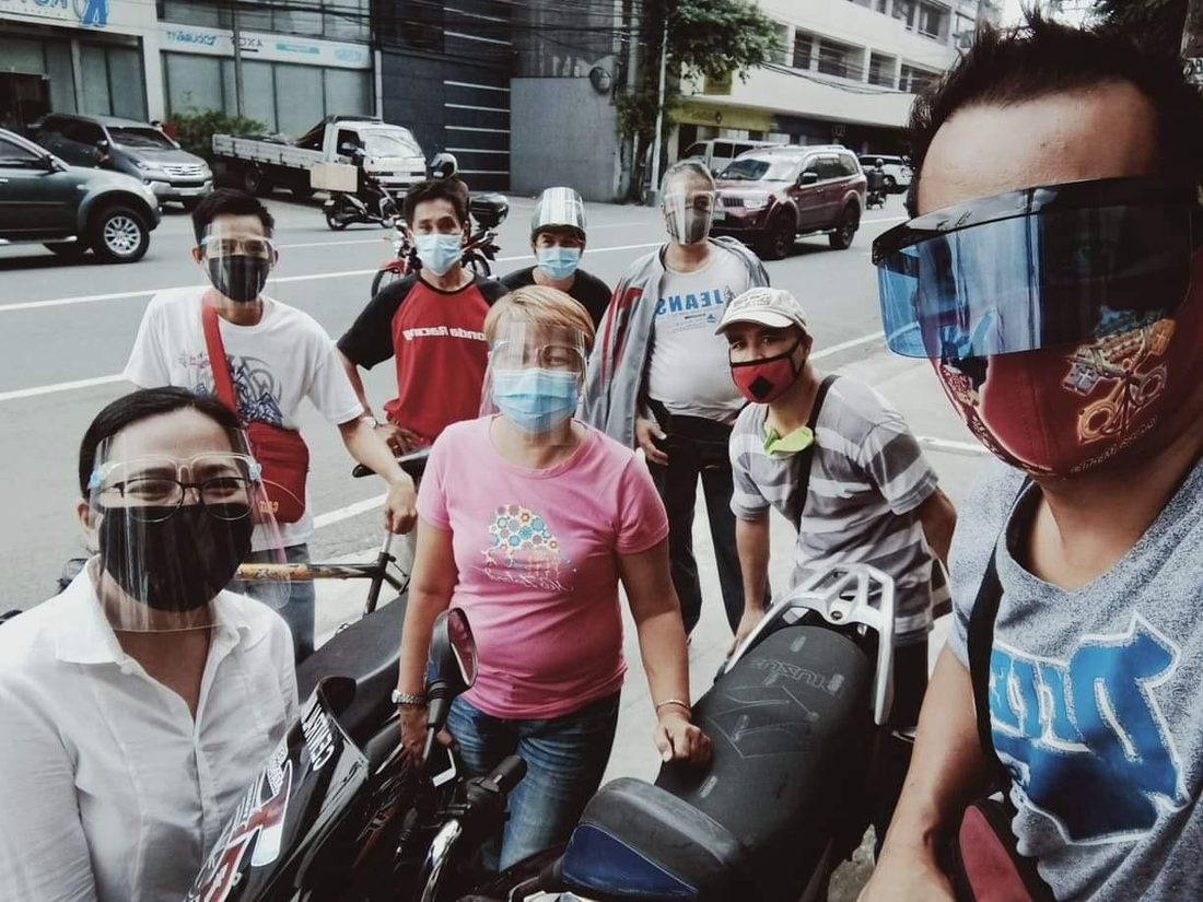 Workers gathered at a Tulong community outreach event